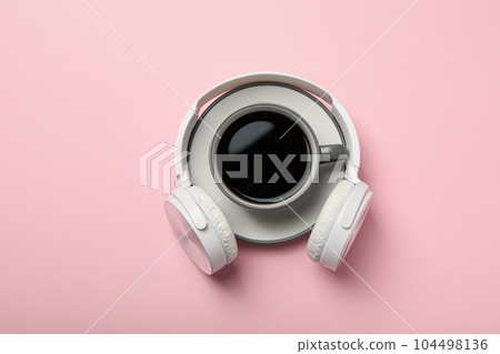 Concept of freelance, composition with hot drink and headphones Concept of freelance, composition with hot drink and headphones 104498136