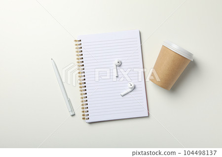 Concept of freelance, composition with hot drink and headphones Concept of freelance, composition with hot drink and headphones 104498137
