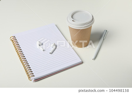 Concept of freelance, composition with hot drink and headphones 104498138