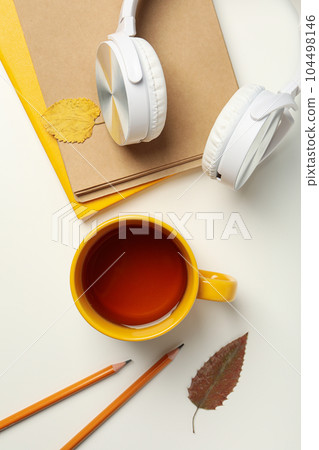 Concept of freelance, composition with hot drink and headphones 104498146