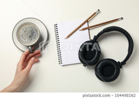 Concept of freelance, composition with hot drink and headphones 104498162