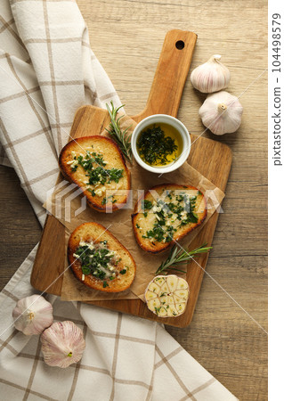Tasty toasts with garlic, homemade products appetizer Tasty toasts with garlic, homemade products appetizer 104498579