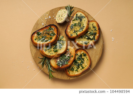 Tasty toasts with garlic, homemade products appetizer Tasty toasts with garlic, homemade products appetizer 104498594