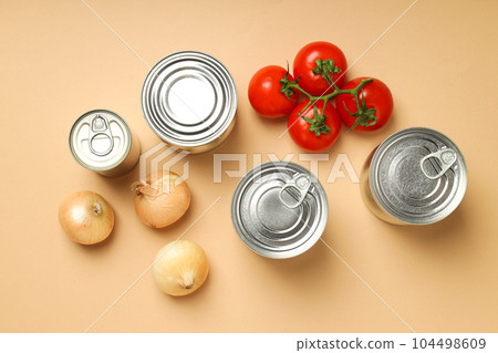 Canned food in blank metal jars, concept of canned food Canned food in blank metal jars, concept of canned food 104498609