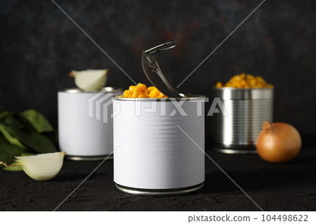 Canned food in blank metal jars, concept of canned food Canned food in blank metal jars, concept of canned food 104498622