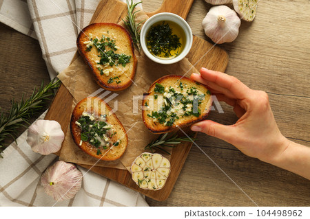 Tasty toasts with garlic, homemade products appetizer Tasty toasts with garlic, homemade products appetizer 104498962