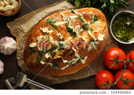Tasty bakery product - garlic bread, homemade bread 104498964