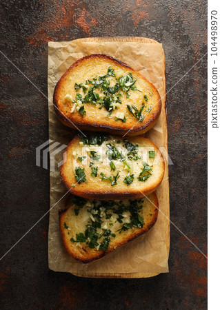 Tasty toasts with garlic, homemade products appetizer Tasty toasts with garlic, homemade products appetizer 104498970