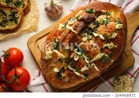 Tasty bakery product - garlic bread, homemade bread Tasty bakery product - garlic bread, homemade bread 104498971