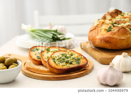 Tasty toasts with garlic, homemade products appetizer Tasty toasts with garlic, homemade products appetizer 104498979
