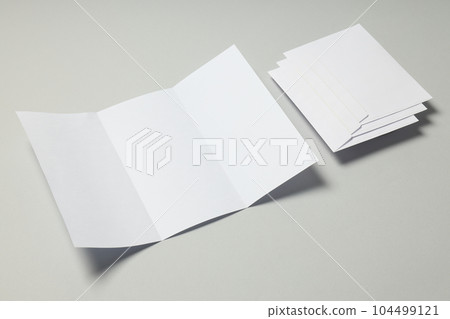 Blank white sheet and envelopes on light gray background Blank white sheet and envelopes on light gray background 104499121