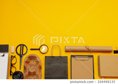 Mockup flat lay with different office accessories on yellow background 104499135