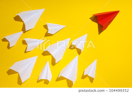 Business, startup and sponsorship concept with paper planes on yellow background Business, startup and sponsorship concept with paper planes on yellow background 104499352