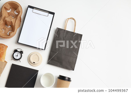 Mockup flat lay with different office accessories on white background Mockup flat lay with different office accessories on white background 104499367