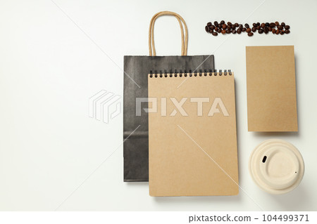 Mockup flat lay with craft accessories and coffee beans on white background Mockup flat lay with craft accessories and coffee beans on white background 104499371