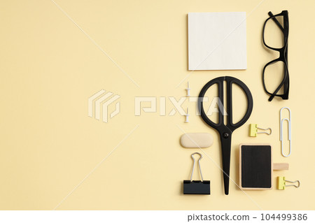 Mockup flat lay with different office accessories on beige background Mockup flat lay with different office accessories on beige background 104499386