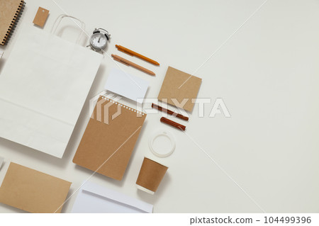 Mockup flat lay with different office accessories on white background 104499396