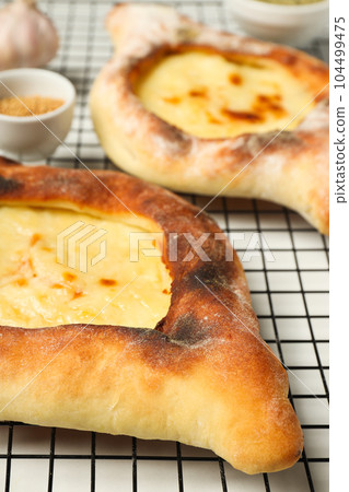National Georgian cuisine food, flour product - Khachapuri National Georgian cuisine food, flour product - Khachapuri 104499475
