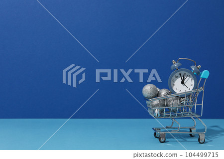 Concept of Christmas shopping time with alarm clock 104499715