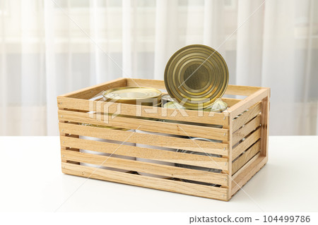 Canned food in blank metal jars, concept of canned food Canned food in blank metal jars, concept of canned food 104499786