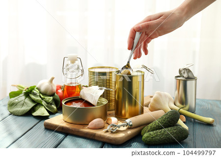 Canned food in blank metal jars, concept of canned food Canned food in blank metal jars, concept of canned food 104499797