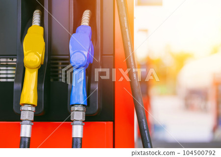 fuel gas station, closeup gasoline fuel nozzle petroleum benzine and diesel or gasohol colors type. 104500792