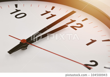 Afternoon 12 o'clock time clock face closeup for lunch brake business working hours. Afternoon 12 o'clock time clock face closeup for lunch brake business working hours. 104500943
