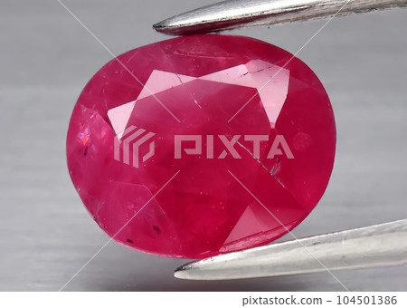 Natural gemstone red ruby on gray background Natural gemstone red ruby on gray background 104501386