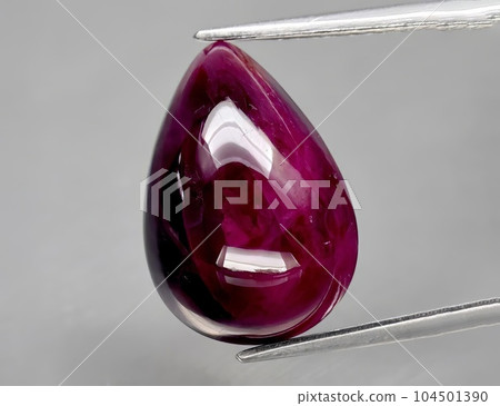 Natural gemstone red ruby on gray background Natural gemstone red ruby on gray background 104501390