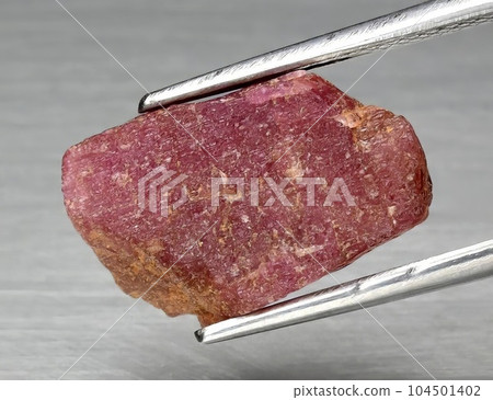 Natural gemstone red ruby on gray background Natural gemstone red ruby on gray background 104501402