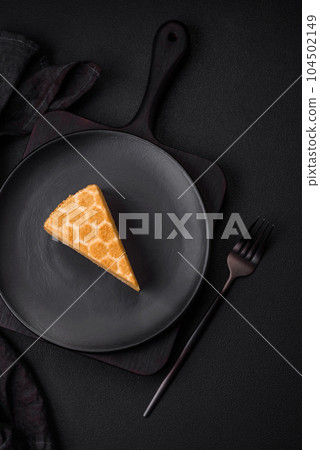 Delicious fresh sweet honey cake layer cake with white cream 104502149