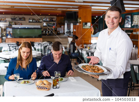 Waiter with tray of crustaceans Waiter with tray of crustaceans 104503018