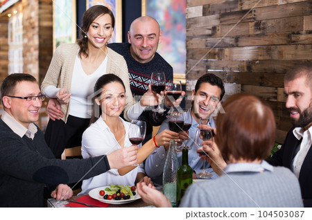 Company celebrating in restaurant Company celebrating in restaurant 104503087