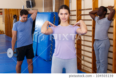 People warming up at gym 104503139