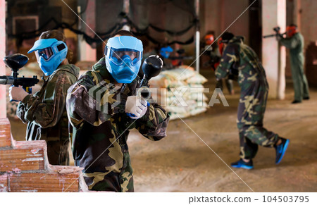 Players of blue team are ready for offensive on battlefield. Players of blue team are ready for offensive on battlefield. 104503795