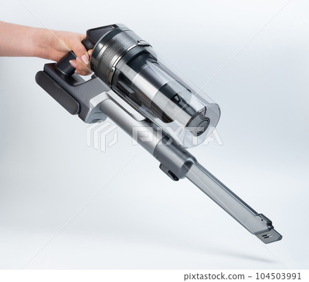 Cleaning floor with portable vacuum cleaner 104503991