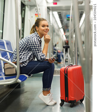 Girl traveler in underground coach 104504021