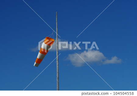Blue sky and windsock 104504558