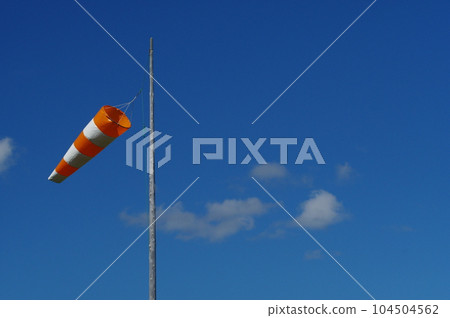 Blue sky and windsock 104504562