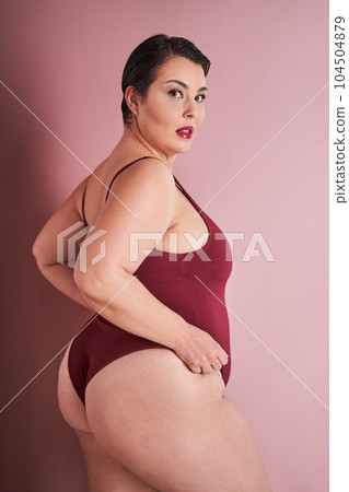 Vertical portrait of the asian woman feeling proud in her natural body 104504879