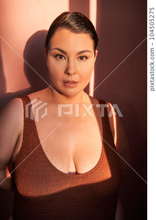 Happy woman feeling positive in her natural body 104505275