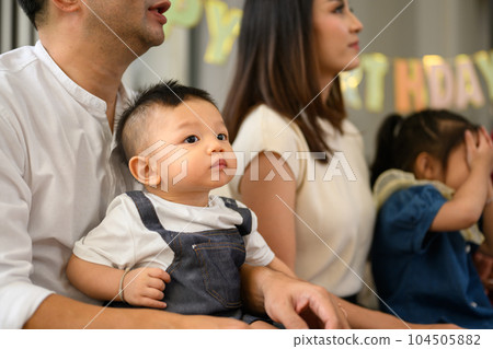 Portrait of happy family spending good time together at home Portrait of happy family spending good time together at home 104505882