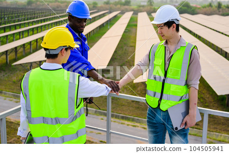 Engineer worker checking and maintaining solar panels on solar farm Engineer worker checking and maintaining solar panels on solar farm 104505941