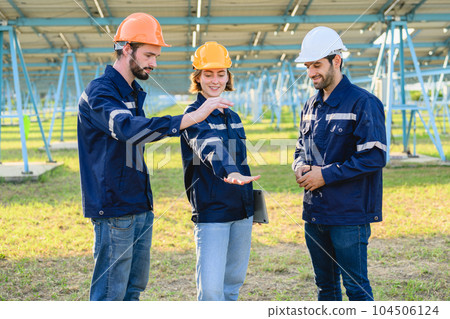 Group of engineers working together at solar power station Group of engineers working together at solar power station 104506124