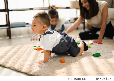 Happy and cheerful family spending good time together at home 104506197