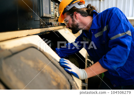 Engineer technician controlling robotic arms on computer laptop 104506279
