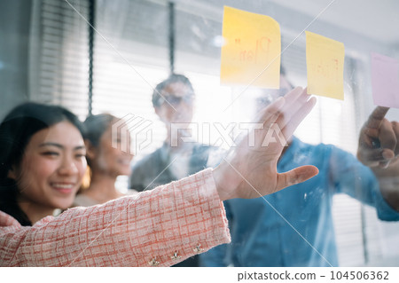 Group of business people working together at modern office 104506362
