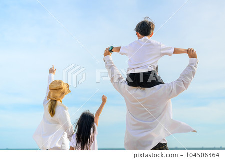 Happy Asian family travel on beach on holiday 104506364