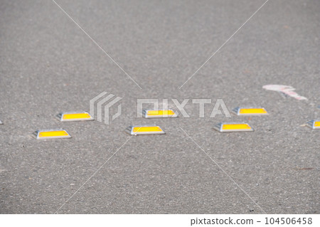 Road hump and cat's eye Road hump and cat's eye 104506458