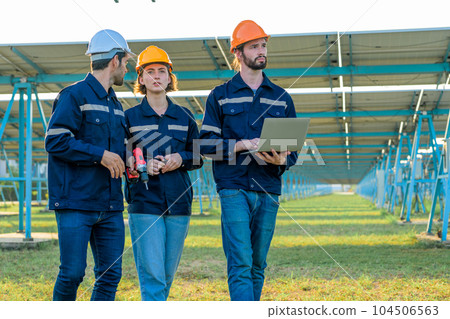 Workers installing solar panels, Engineer team at solar panel farm Workers installing solar panels, Engineer team at solar panel farm 104506563